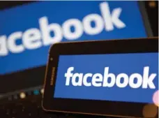  ?? JUSTIN TALLIS/AFP/GETTY IMAGES ?? With nearly two billion users and a growing advertisin­g business, Facebook could provide billions in new sales for the music industry.