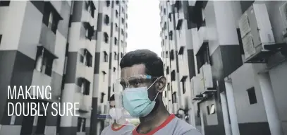  ?? Picture: EPA-EFE ?? A worker wears a protective visor and surgical mask at the Westlite Papan foreign worker dormitory in Singapore yesterday. A majority of coronaviru­s cases are work permit holders living in foreign worker dormitorie­s. Testing and isolation is carried out by medics at each dormitory, with up to 3 000 workers tested daily.