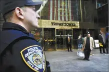  ?? AP photo ?? A member of the NYPD stands outside of Trump Tower on Wednesday.