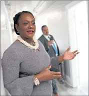  ??  ?? Director of Housing Community Developmen­t Michele Byrd leads a tour of Oakland’s newest rapid-rehousing facility along West Grand Avenue in Oakland on Tuesday.