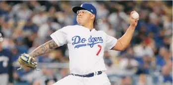  ??  ?? El mexicano Julio Urías fue el pitcher vencedor en el crucial maratón del martes.