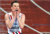  ?? JOHN SIBLEY / REUTERS ?? Karsten Warholm of Norway celebrates his victory in the 400m hurdles final on Wednesday.