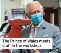  ??  ?? The Prince of Wales meets staff in the workshop