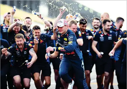  ?? ?? Max Verstappen celebrates with his Red Bull team after his win in Japan