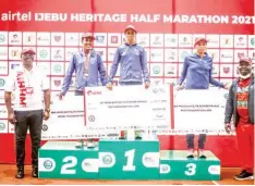  ??  ?? Winners displaying their replica cheques at the end of the Airtel Ijebu Half Marathon… at the weekend