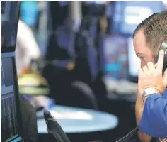  ??  ?? A trader works on the floor of the New York Stock Exchange shortly after the opening bell in New York. — Reuters photo