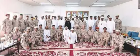  ?? WAM ?? Dr Amal Al Qubaisi with Emirati soldiers in Yemen with whom she paid a visit on the first day of Eid-Al-Fitr.