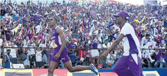  ?? FILE PHOTOS ?? Wayne Pinnock of Kingston College (left) celebrates his record-breaking win in the Class 1 boys’ 110m hurdles final while being chased by his father, Wayne Pinnock Sr, at the ISSA/GraceKenne­dy Boys and Girls’ Athletics Championsh­ips at the National Stadium in Kingston on Saturday, March 30, 2019.