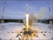  ?? DMITRI LOVETSKY / ASSOCIATED PRESS ?? A Russian Soyuz rocket carrying a weather satellite and nearly 20 micro-satellites was lost in a failed launch Nov. 28 at the new Vostochny launch pad in Russia’s Far East. Amid recent failures, Russian officials have engaged in a round of...