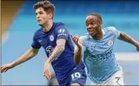  ?? Matthew Ashton / Getty Images ?? Christian Pulisic of Chelsea and Raheem Sterling of Manchester City during a May 8 match. Sporting stadiums around the UK remain under strict restrictio­ns.