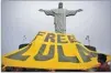  ??  ?? Pilar OLIVARES/REUTERS Supporters of former Brazilian president Luiz Inacio Lula da Silva display a banner in front of the statue of Christ the Redeemer in Rio de Janeiro, Brazil, on April 14, 2018.