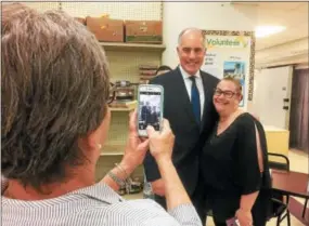  ?? EVAN BRANDT — DIGITAL FIRST MEDIA ?? Renee Gorski, who is a SNAP recipient and spoke Monday about the difficulti­es she will face if the program is cut in the farm bill now under considerat­ion in Congress, gets a photo with U.S. Sen. Bob Casey.