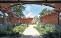  ?? BERNARD CLARK ?? The courtyard walls and fence are clad in red cedar, with an oculus-like opening to the sky, creating a cosy outdoor living area that maximizes natural light.