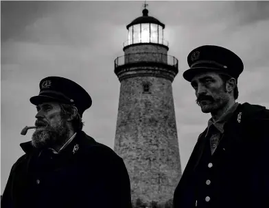  ??  ?? ABOVE: Willem Dafoe and Robert Pattinson in Robert Eggers’s film The Lighthouse, released in the UK later this month. BELOW: The original Smalls Lighthouse, built in 1776, with its lamp room held aloft above the waves by nine oak pillars.