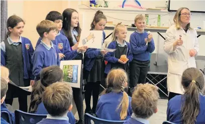  ??  ?? Some of the children at St Gregory’s Primary School taking part in British Science Week