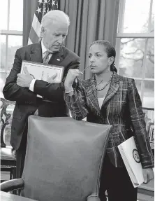  ?? VIA USA TODAY] ?? President-elect Joe Biden and former National Security Advisor Susan Rice talk as President Barack Obama and Iraqi Prime Minister Haider al-Abadi brief the press after a bilateral meeting in the Oval Office of the White House on April 14, 2015, in Washington. [POOL/GETTY IMAGES