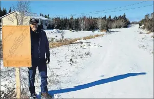  ?? SUBMITTED PHOTO ?? Groves Point resident Clifford MacNeil stands beside a sign showing the lots of a subdivisio­n he wants to continue developing on family-owned property. MacNeil is upset that the Cape Breton Regional Municipali­ty recently refused to approve the final...