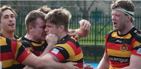  ??  ?? Sligo players celebrate as Mike Wells scores Sligo’s fifth try as they defeat Malahide 34-32 to go top of Division 2C.