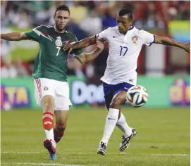  ??  ?? Mexico’s Miguel Layun and Portugal’s Nani