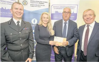  ??  ?? ● The Aloud Charity’s Eleri Watkins and, right, Dangerpoin­t’s Cat Harvey-Aldcroft and Julie Evans receive the Your Community, Your Choice grants from Assistant Chief Constable Richard Debicki, North Wales Police and Crime Commission­er Arfon Jones and...