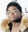  ?? MIKE COPPOLA/GETTY 2018 ?? Kodak Black was charged with two counts of being a felon in possession of a weapon by officials in Miami-Dade Friday.