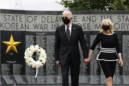  ?? Photograph: Patrick Semansky/AP ?? Joe Biden and Jill Biden depart after placing a wreath at the Delaware Memorial Bridge Veterans Memorial Park.