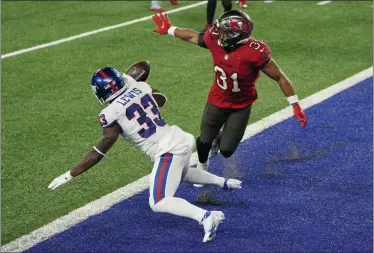  ?? COREY SIPKIN ?? Tampa Bay Buccaneers’ Antoine Winfield Jr., right, breaks up a two- point conversion- attempt to New York Giants’ Dion Lewis during the second half of an NFL football game, Monday, Nov. 2, 2020, in East Rutherford, N. J.