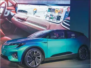  ?? HAO YAN / CHINA DAILY ?? Byton’s concept car features a 49-inch curved screen and a big tough screen on the steering wheel.