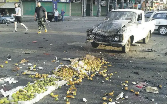  ?? Reuters ?? The damage from a suicide bomb attack in Sweida, Syria. The Syrian Observator­y for Human Rights said three suicide attackers hit the city yesterday