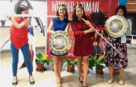  ?? — Women Who Code ?? The Women Who Code team (l-r) Goh, Daphne Choong, Yeen and Wendy Kong Wei Zhen during their recent Wonder Woman themed women’s day celebratio­n.