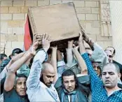  ?? ALAA ELKASSAS/AP ?? The coffin of police Capt. Ahmed Fayez, who was killed in a gunbattle that started Friday, is carried Saturday in Cairo.