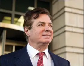  ?? AP Photo/Andrew Harnik, File ?? Lawyer: In this Thursday, Nov. 2, 2017, file photo, Paul Manafort, President Donald Trump's former campaign chairman, leaves Federal District Court, in Washington. Prosecutor­s working for special counsel Robert Mueller are accusing former Trump...