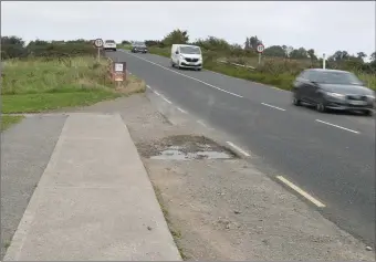  ??  ?? The bridge at Colpe which schoolchil­dren have to cycle and walk over. The footpaths ends abruptly, forcing children onto the roadside.