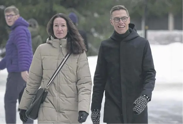  ?? ?? National Coalition presidenti­al candidate and joint frontrunne­r Alexander Stubb with wife Suzanne after voting at a polling station yesterday