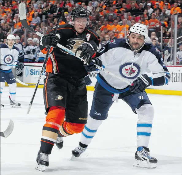  ?? — GETTY IMAGES FILES ?? Dustin Byfuglien, right, put on a poor performanc­e in Winnipeg’s loss in Game 3. The defenceman was on the ice for three Ducks goals and took a shot at Corey Perry as the Anaheim winger celebrated a goal. Byfuglien didn’t offer much to media on Tuesday.