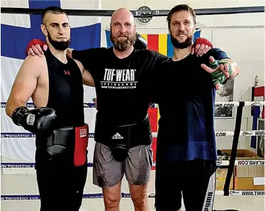  ?? ?? EXPERIENCE AND YOUTH: Bezus [left] in training with veteran Robert Helenius and novice pro Volodymyr Katsuk [right]