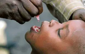  ?? —AP ?? SOURCE A Congolese child is given a polio vaccinatio­n in Rwanda. In a report issued on Nov. 22, the World Health Organizati­on said four African countries reported more new cases of polio linked to the oral vaccine than from the wild.