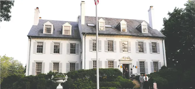  ?? Richard A. Lipski / Washington Post files ?? “Hickory Hill,” the home of Robert Kennedy and his family in Mclean, Va., 1957 - 2010. A planter sought by his daughter Kerry is seen next to the flagpole in 2009.