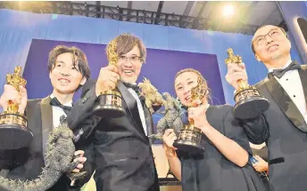  ?? — AFP photo ?? Tatsuji Nojima,Takashi Yamazaki, Kiyoko Shibuya and Masaki Takahashi, attends the 96th Annual Academy Awards Governors Ball after winning the Oscar for Best Visual Effects for ‘Godzilla Minus One’ at the Dolby Theatre in Hollywood, California.