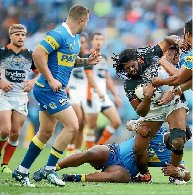  ??  ?? A barnstormi­ng Jamal Idris proves difficult to handle for Parramatta this year before a serious knee injury ended his season.