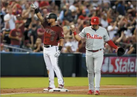  ?? RICK SCUTERI — THE ASSOCIATED PRESS ?? Arizona Diamondbac­ks’ David Peralta (6) celebrates after hitting an RBI triple against the Phillies in the third inning Wednesday in Phoenix.