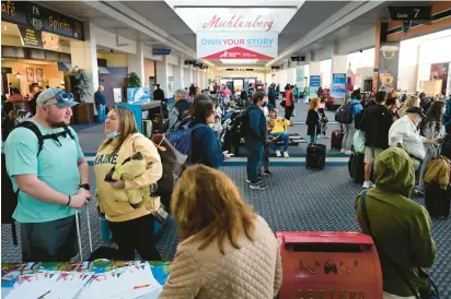  ?? RICK KINTZEL/THE MORNING CALL PHOTOS ?? Passengers arrive Tuesday at Lehigh Valley Internatio­nal Airport.