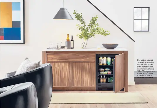  ?? AMHERST CABINETS ?? This walnut cabinet can work as a resting spot for a TV, books or art objects, while the interior is a handy fridge. The top comes in a variety of colors in granite or quartz.