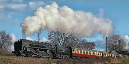  ?? ?? Prior to its withdrawal, No. 92214 enjoyed a full week of operation on half-term and weekend trains. It is seen passing Kinchley Lane with the 3pm Leicester North to Loughborou­gh on February 24. GRAHAM NUTTALL