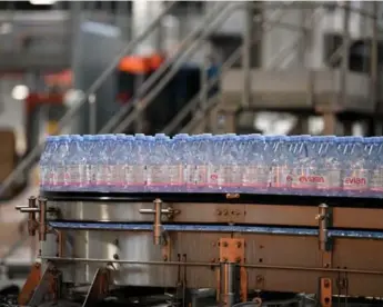  ?? JEAN-PIERRE CLATOT/AFP/GETTY IMAGES ?? Danone CEO Emmanuel Faber reinaugura­ted Evian’s newly carbon-neutral bottling plant in France on Tuesday.