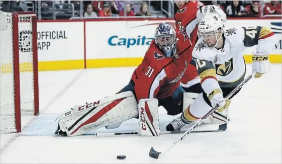  ?? ALEX BRANDON THE ASSOCIATED PRESS ?? Vegas Golden Knights centre Ryan Carpenter (40) lunges to shoot the puck as Washington Capitals goalie Philipp Grubauer defends in the first period Sunday. Vegas won the game, 4-3.