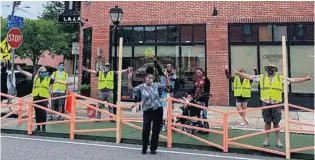  ?? COURTESY OF OPENNORFOL­K ?? Beverly McDonald, front, at the new “parklet” that city organizati­on OpenNorfol­k is building as an outdoor dining area for her restaurant, Croaker’s Spot.