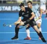  ?? PHOTO: GETTY IMAGES ?? Black Sticks striker Marcus Child controls the ball as Argentina defender Pedro Ibarra looks on during their pool A match at the FIH World Cup match in Bbhubanesw­ar, India, yesterday.