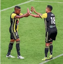  ?? PHOTOSPORT ?? Roy Krishna, left, became the Phoenix’s alltime leading scorer with his goal against Perth Glory at the weekend.