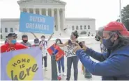  ?? CHIP SOMODEVILL­A/GETTY IMAGES/TNS ?? Advocates for immigrants with Deferred Action for Childhood Arrivals, or DACA, rally in front of the U.S. Supreme Court on June 15 in Washington.